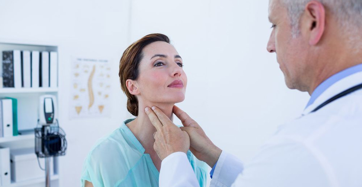 Doctor-examining-patient-for-laryngeal-cancer